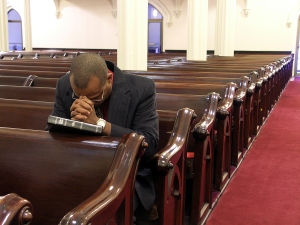 Believer Praying in Church